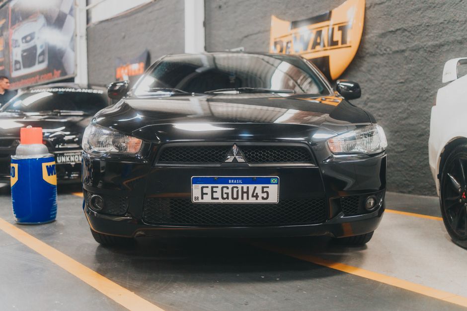 Shiny black sports car showing paint protection results